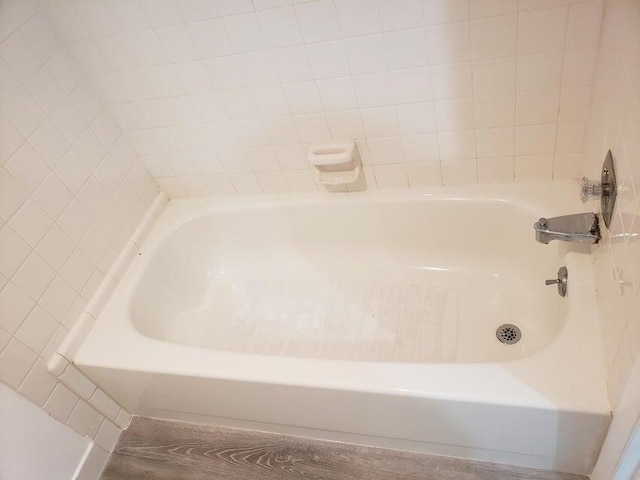 bathroom featuring a tub to relax in