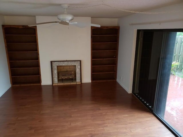 unfurnished living room featuring hardwood / wood-style floors and ceiling fan