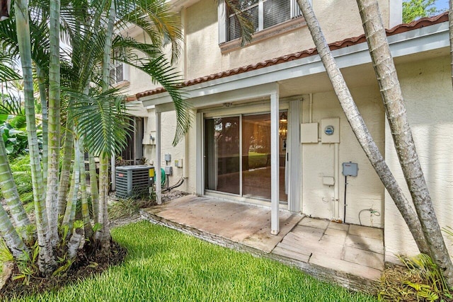 doorway to property with central AC