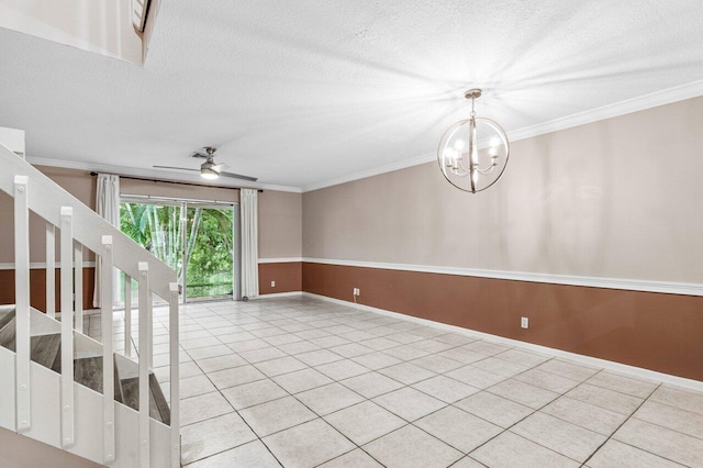 empty room with ornamental molding, ceiling fan with notable chandelier, and a textured ceiling