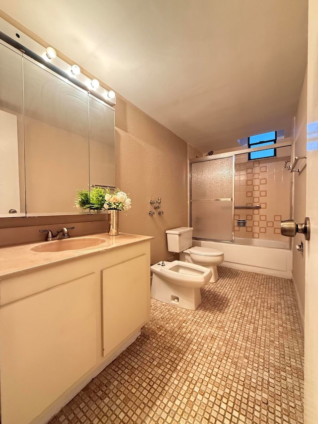 full bathroom with tile patterned floors, toilet, enclosed tub / shower combo, and a bidet