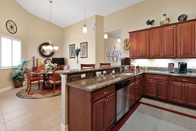 kitchen with hanging light fixtures, kitchen peninsula, sink, light tile patterned floors, and stainless steel dishwasher