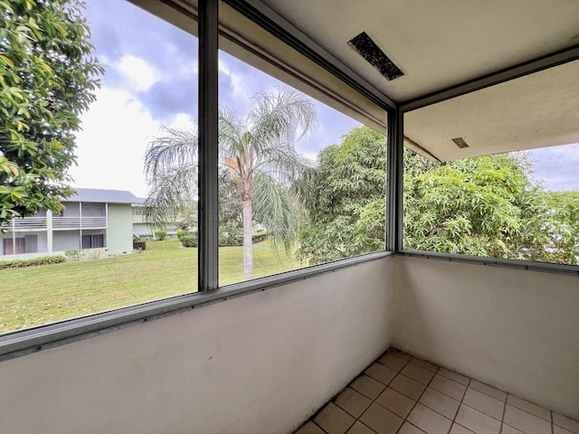 unfurnished sunroom with plenty of natural light