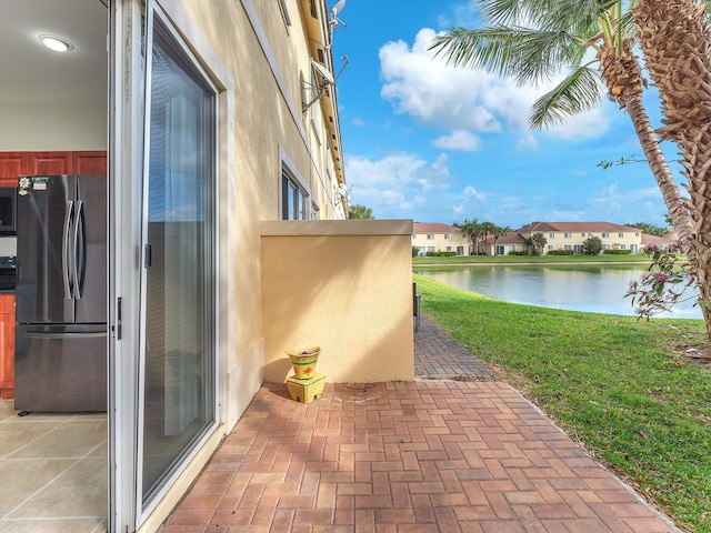 view of patio featuring a water view