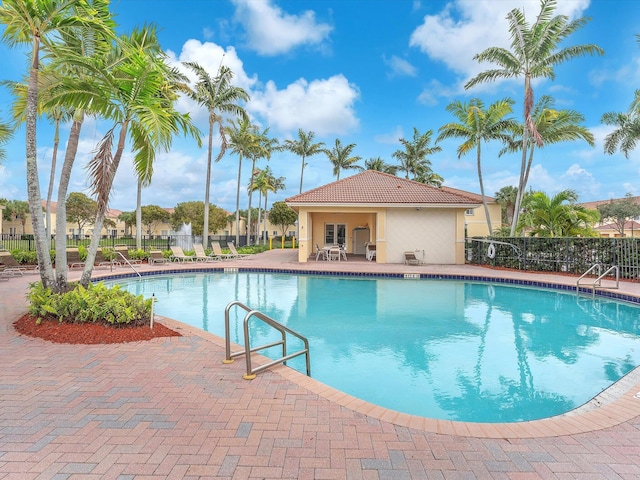 view of swimming pool with a patio