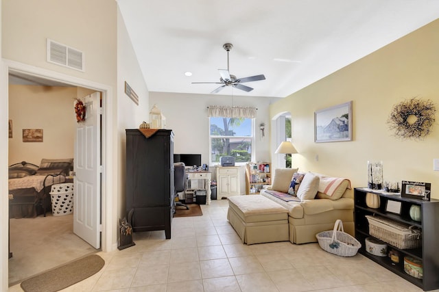 tiled living room with ceiling fan