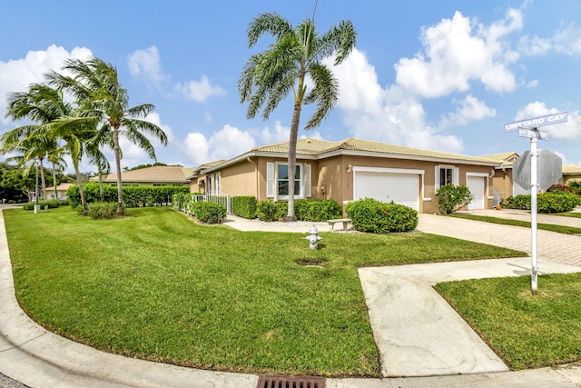 view of front facade with a front yard and a garage