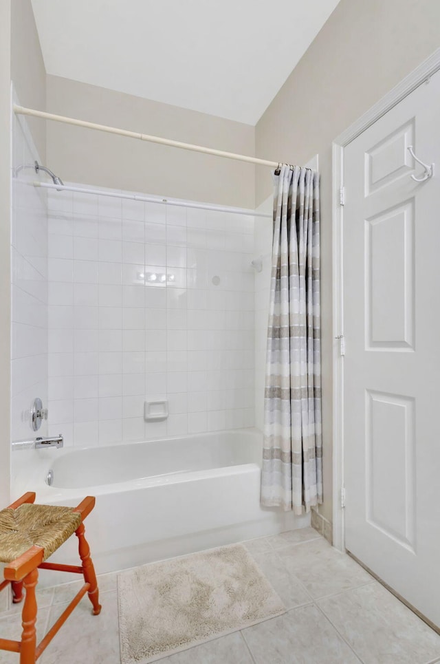 bathroom featuring tile patterned floors and shower / bathtub combination with curtain