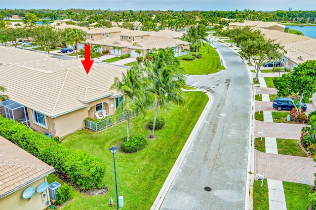 birds eye view of property with a water view