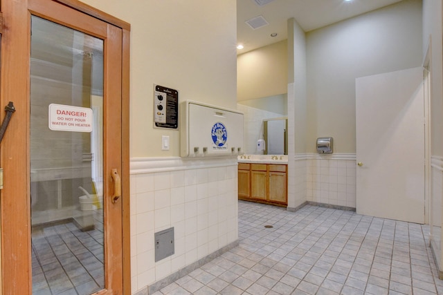 bathroom with vanity, toilet, and tile patterned flooring