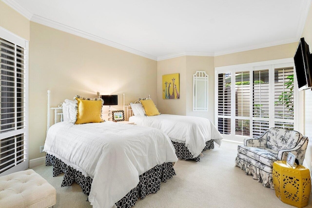 carpeted bedroom with ornamental molding