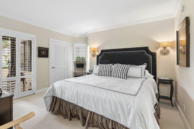 carpeted bedroom featuring multiple windows, access to exterior, and crown molding