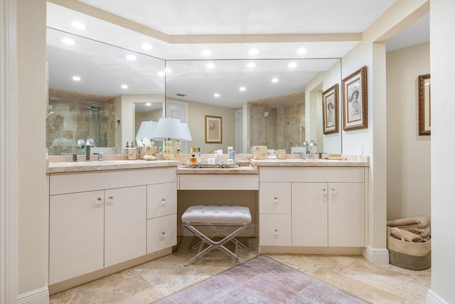 bathroom featuring vanity and an enclosed shower