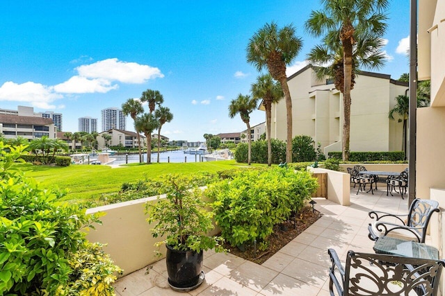 view of patio with a water view