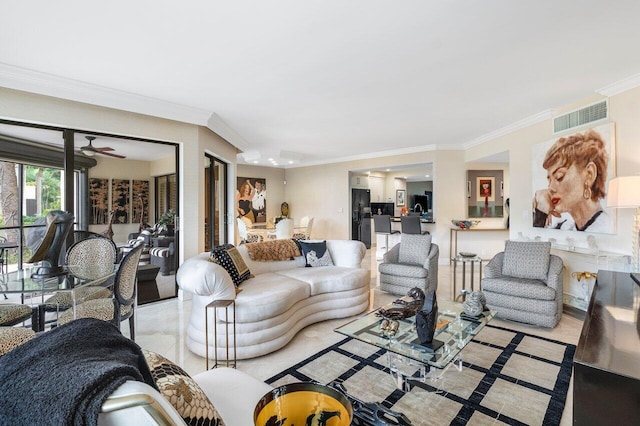 living room with ceiling fan and ornamental molding