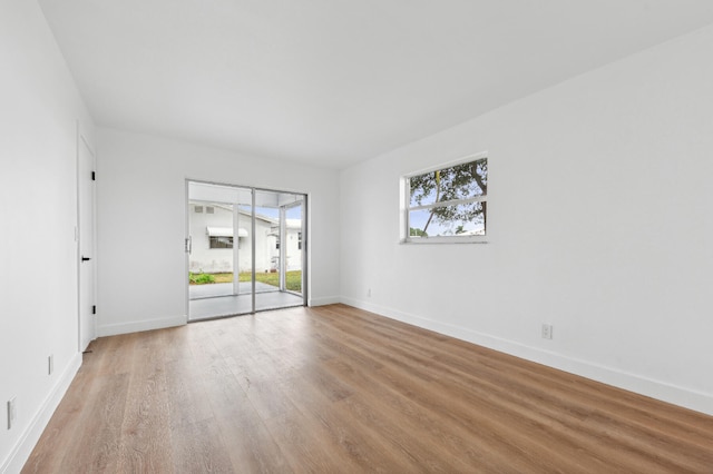 unfurnished room with light hardwood / wood-style flooring