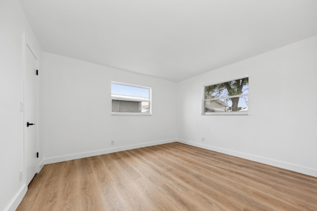 spare room featuring light wood-type flooring