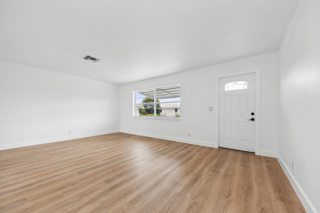 foyer entrance with light hardwood / wood-style flooring