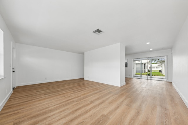 unfurnished living room featuring light hardwood / wood-style flooring