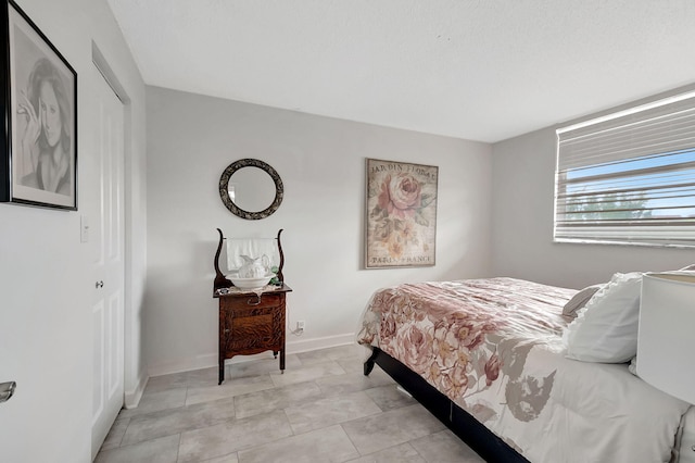 720 E Ocean Ave Unit 303, Boynton Beach, FL 33435 - bedroom featuring a closet and baseboards