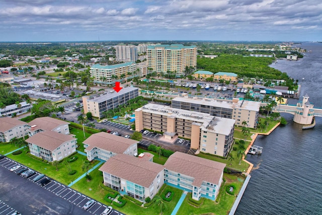 birds eye view of property with a water view