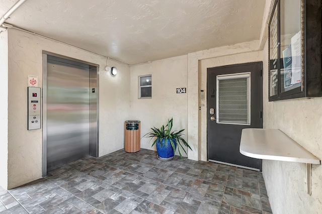 720 E Ocean Ave Unit 303, Boynton Beach, FL 33435 - entrance to property featuring elevator and stucco siding