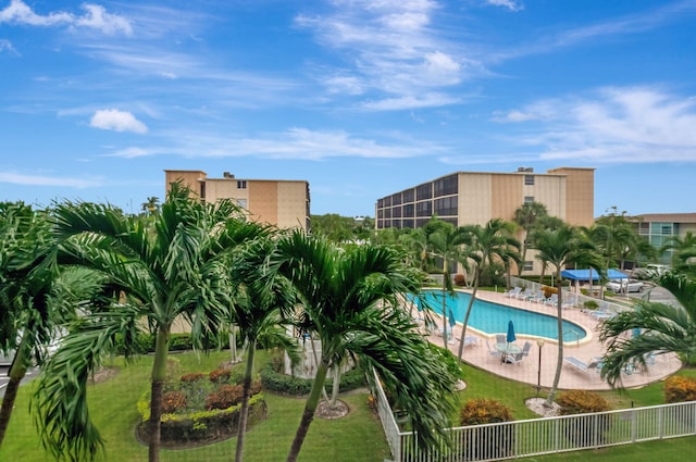 view of pool with a yard and a patio