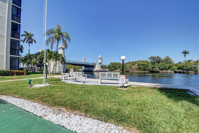 exterior space featuring a yard and a water view