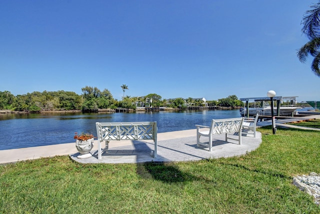 720 E Ocean Ave Unit 303, Boynton Beach, FL 33435 - dock area featuring a lawn and a water view