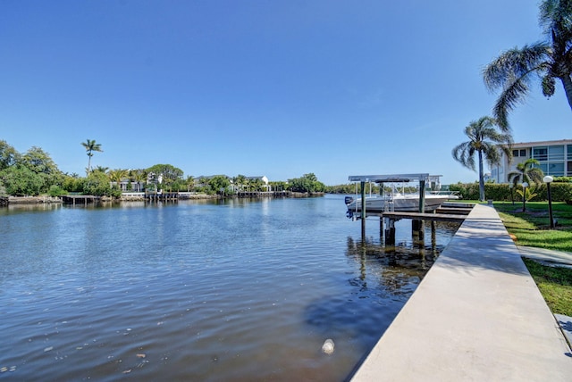 720 E Ocean Ave Unit 303, Boynton Beach, FL 33435 - dock area featuring boat lift and a water view