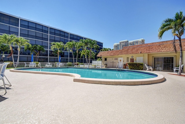 view of swimming pool with a patio area