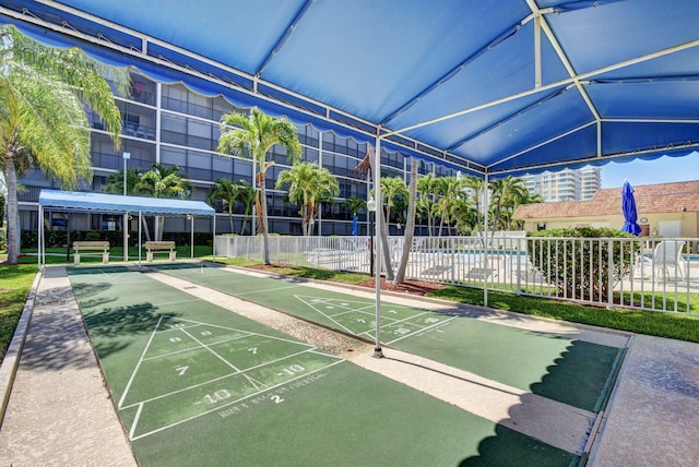 720 E Ocean Ave Unit 303, Boynton Beach, FL 33435 - view of home's community featuring shuffleboard and fence