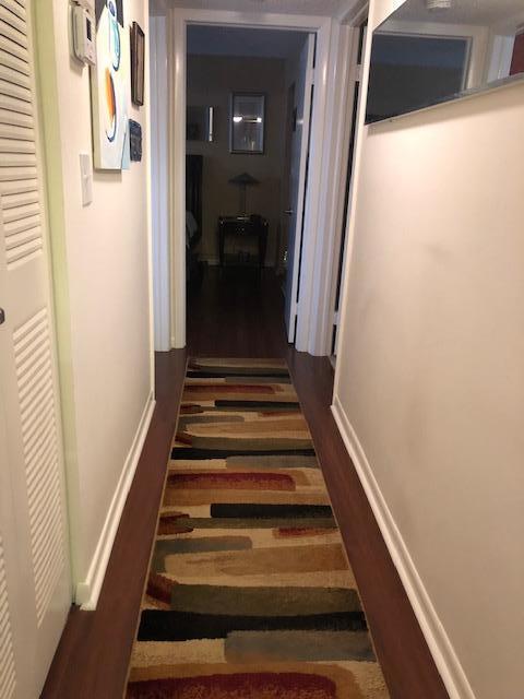 hallway featuring dark hardwood / wood-style floors