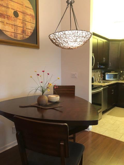 dining space with light hardwood / wood-style floors and sink