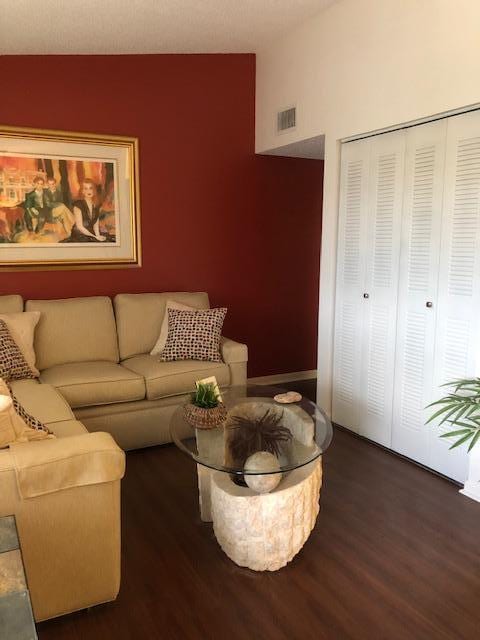 living room with dark wood-type flooring