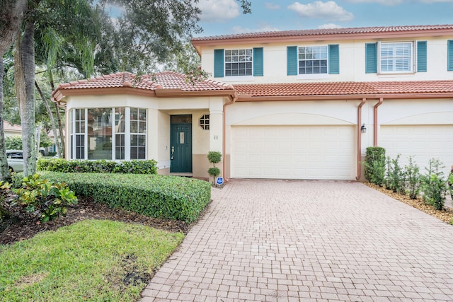 mediterranean / spanish-style house featuring a garage