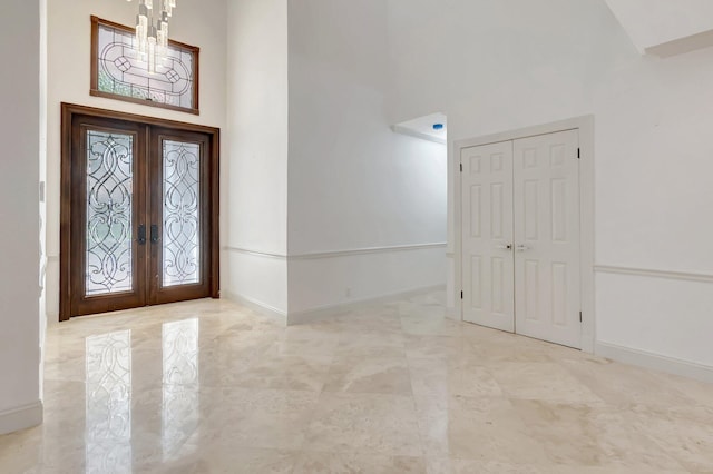 930 N Parkside Cir N, Boca Raton, FL 33486 - foyer entrance with marble finish floor, french doors, baseboards, and a towering ceiling