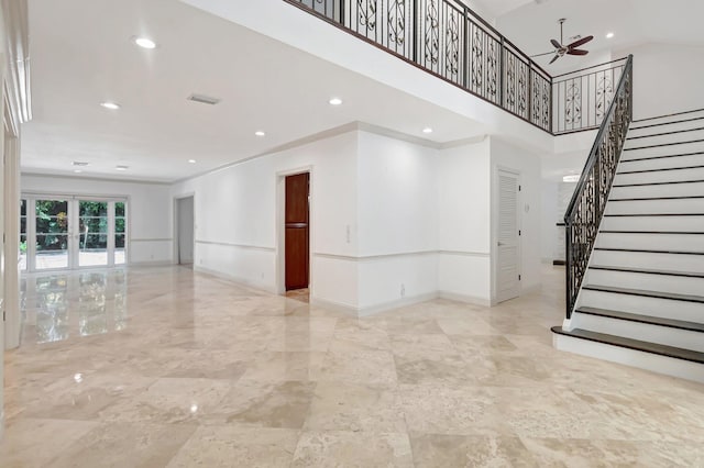 930 N Parkside Cir N, Boca Raton, FL 33486 - spare room featuring stairway, a ceiling fan, and baseboards