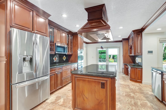930 N Parkside Cir N, Boca Raton, FL 33486 - kitchen with glass insert cabinets, a kitchen island, appliances with stainless steel finishes, crown molding, and decorative backsplash