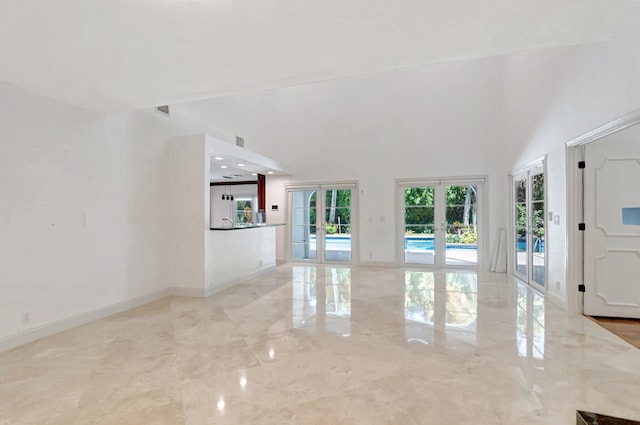 930 N Parkside Cir N, Boca Raton, FL 33486 - interior space with french doors, marble finish floor, a towering ceiling, and baseboards