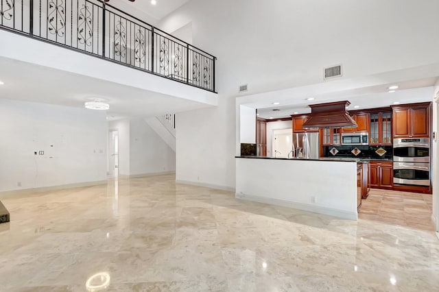930 N Parkside Cir N, Boca Raton, FL 33486 - kitchen featuring dark countertops, island range hood, visible vents, and stainless steel appliances
