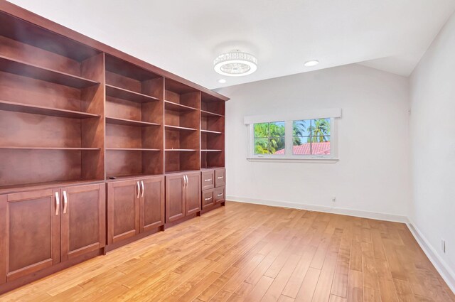 930 N Parkside Cir N, Boca Raton, FL 33486 - unfurnished room featuring light wood finished floors, lofted ceiling, and baseboards