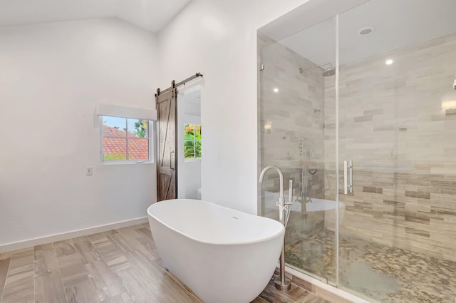 930 N Parkside Cir N, Boca Raton, FL 33486 - bathroom with baseboards, a freestanding bath, lofted ceiling, and a shower stall