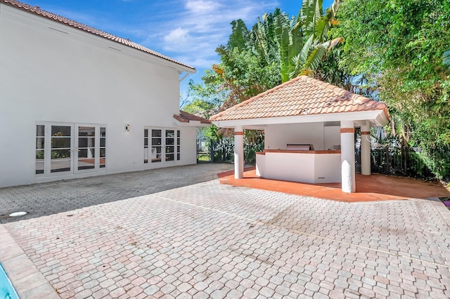 930 N Parkside Cir N, Boca Raton, FL 33486 - view of patio / terrace with a gazebo, french doors, outdoor dry bar, and fence