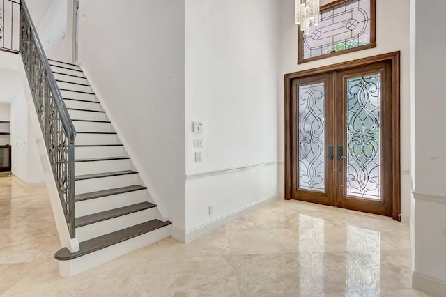 930 N Parkside Cir N, Boca Raton, FL 33486 - foyer with a wealth of natural light, stairway, marble finish floor, and french doors