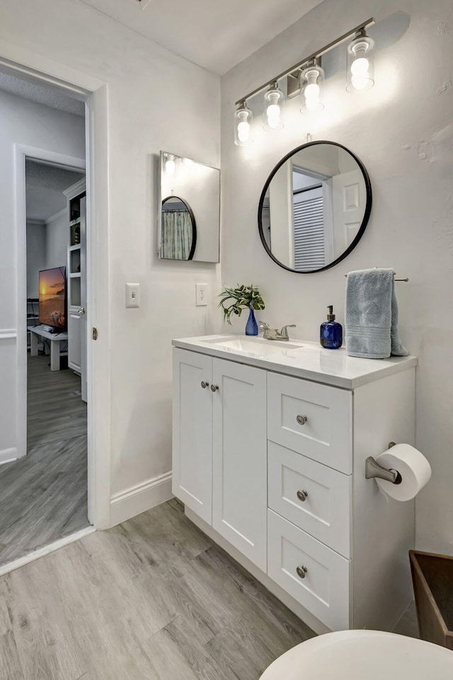 bathroom featuring vanity and hardwood / wood-style floors