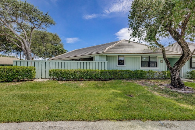 view of side of home featuring a yard