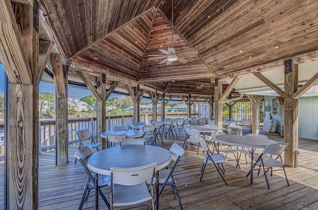 wooden terrace featuring ceiling fan