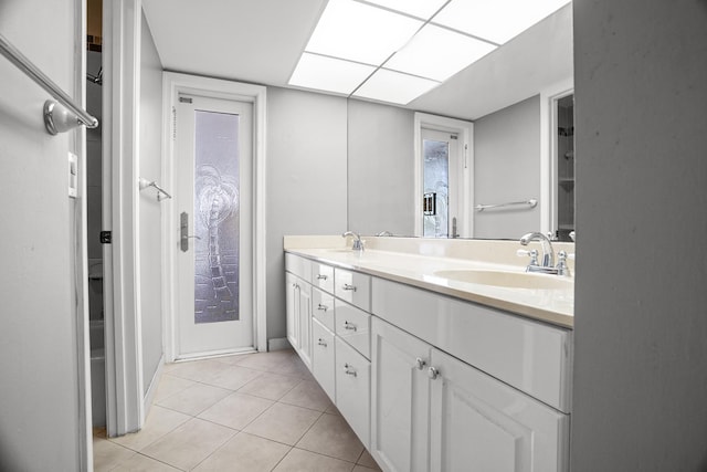100 SW 15th Ct, Boca Raton, FL 33486 - full bath featuring double vanity, a sink, and tile patterned flooring