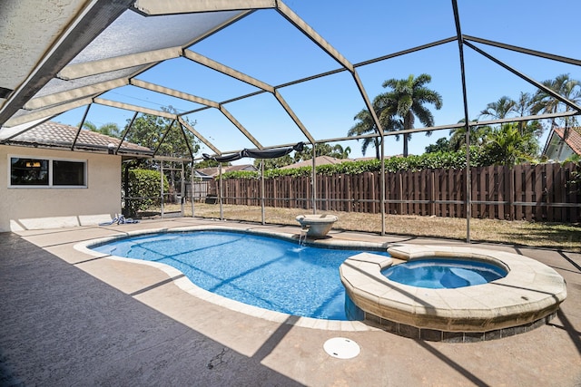 100 SW 15th Ct, Boca Raton, FL 33486 - view of swimming pool featuring glass enclosure, fence, a pool with connected hot tub, and a patio area